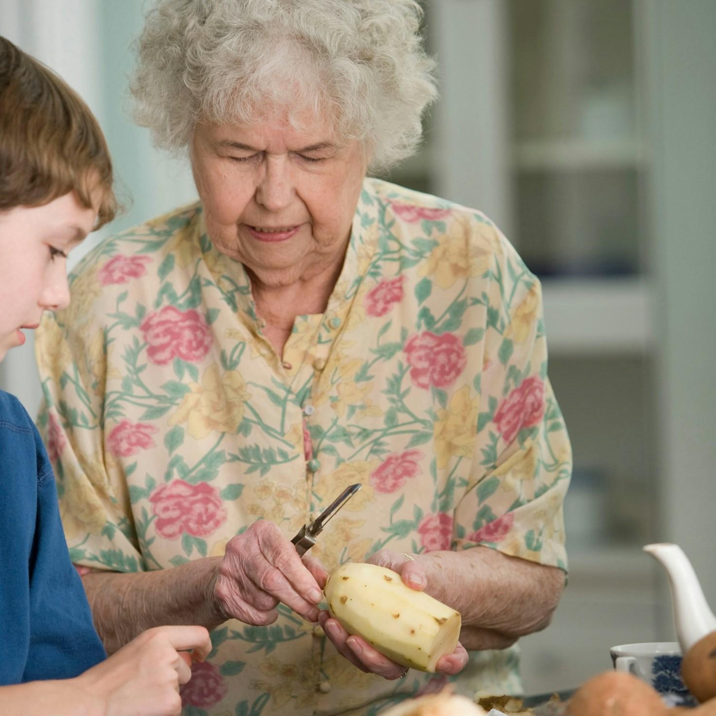 Community members collaborating in a modern kitchen space, sharing recipes and cooking techniques